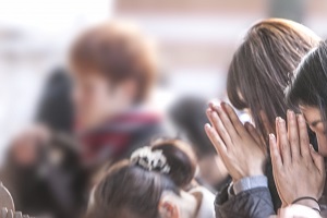 Worshipping people at a temple