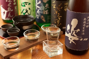 Some bottles of Sake and the glasses