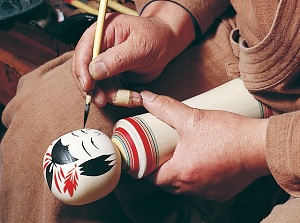 Painting pictures on Kokeshi