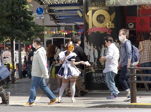 Attracting passerby to Maid cafe in Akihabara